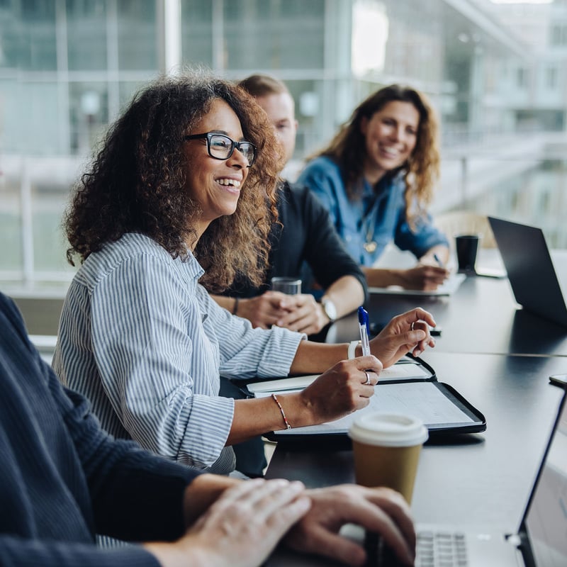 Woman confidently speaking to her team