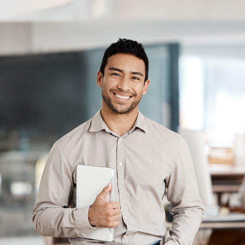 Man smiling holding an ipad